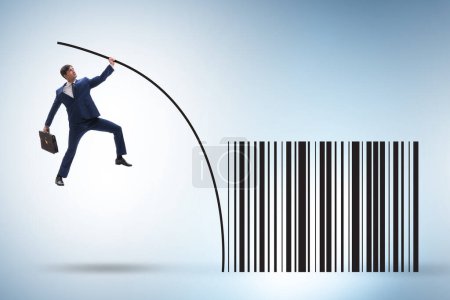 Photo for Businessman jumping over bar code in the pole vaulting - Royalty Free Image