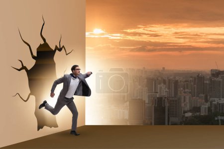 Photo for Businessman breaking through a wall - Royalty Free Image