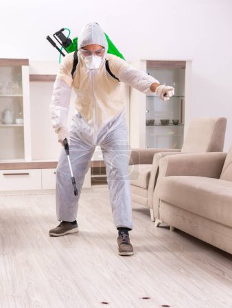 Photo for The pest control contractor working in the flat - Royalty Free Image
