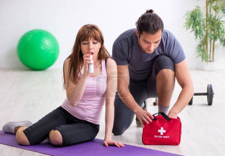 Photo for The young woman feeling bad during training in first aid concept - Royalty Free Image