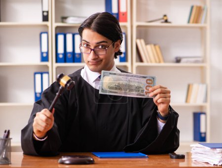 Photo for The young handsome judge working in court - Royalty Free Image