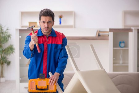 Photo for Young carpenter working at home - Royalty Free Image