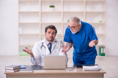 Photo for Two doctors in telemedicine concept - Royalty Free Image