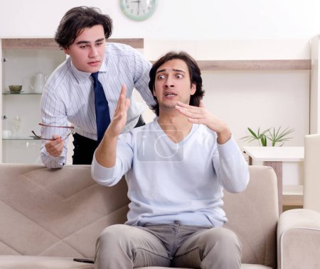 Photo for Young male patient discussing with psychologist personal problems - Royalty Free Image