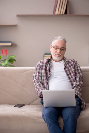 Photo for Old man working from home - Royalty Free Image
