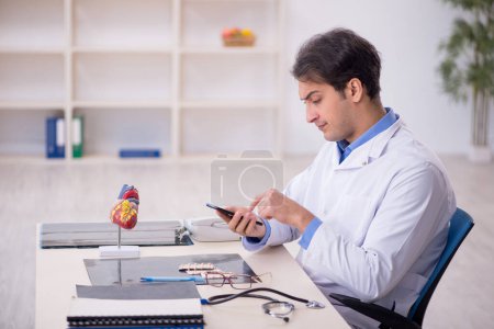 Photo for Young doctor in telemedicine concept - Royalty Free Image