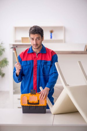 Photo for Young carpenter working at home - Royalty Free Image