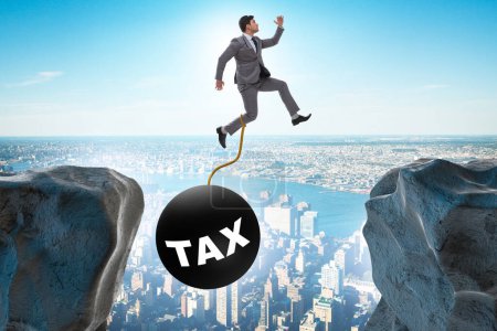 Photo for Concept of tax burden with businessman over the chasm - Royalty Free Image
