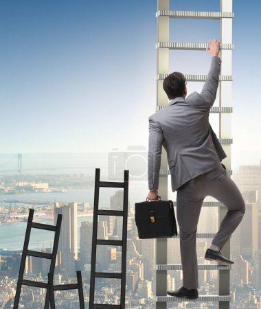 Foto de El concepto de carrera con el hombre de negocios escalando escalera - Imagen libre de derechos
