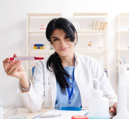 Photo for The female chemist working at the lab - Royalty Free Image