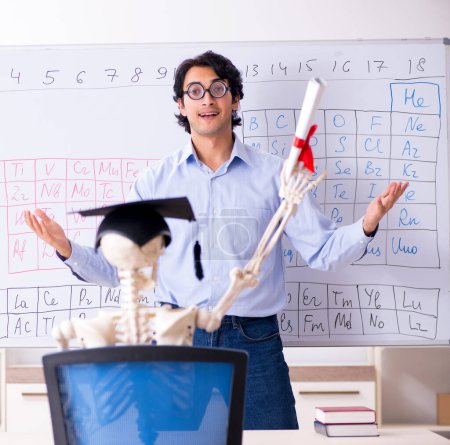 Photo for The young male chemist teacher and student skeleton - Royalty Free Image