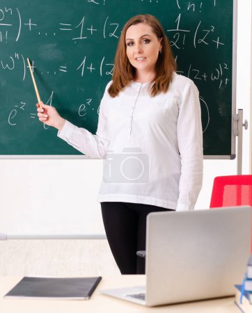 Photo for The female math teacher in the classroom - Royalty Free Image