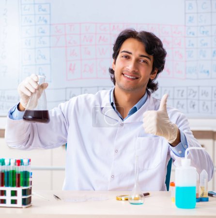 Photo for The young chemist working in the lab - Royalty Free Image