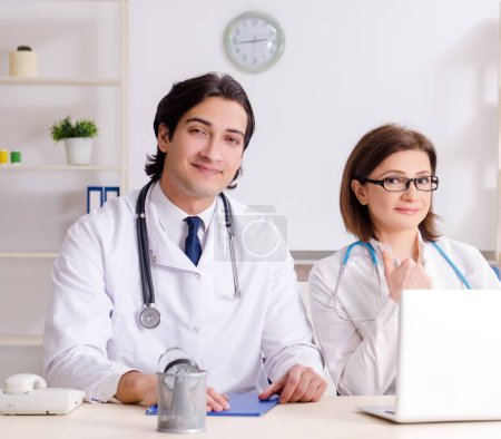 Photo for The two doctors working in the clinic - Royalty Free Image