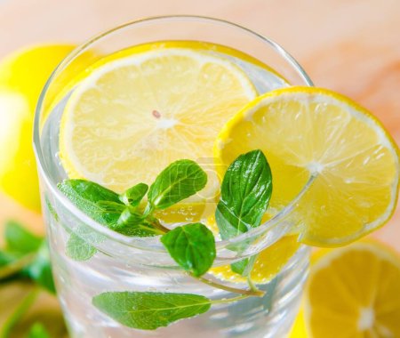 Photo for The glasss of mojito with lemon and drinking straw - Royalty Free Image