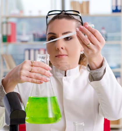 Photo for The female biotechnology scientist chemist working in the lab - Royalty Free Image