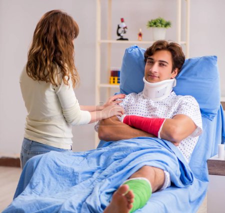 Photo for The loving wife looking after injured husband in hospital - Royalty Free Image
