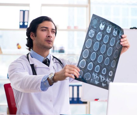 Photo for The young handsome male radiologist in front of whiteboard - Royalty Free Image