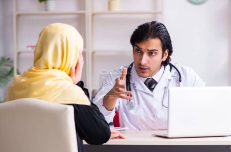 Photo for The female arab patient visiting male doctor - Royalty Free Image