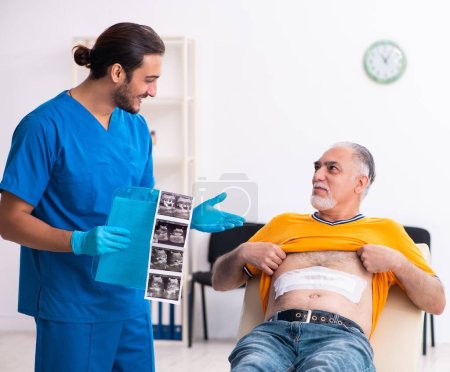 Photo for Old man visiting male doctor - Royalty Free Image