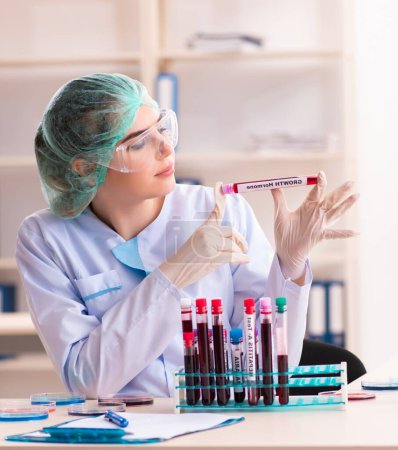 Photo for The young female chemist working in the lab - Royalty Free Image