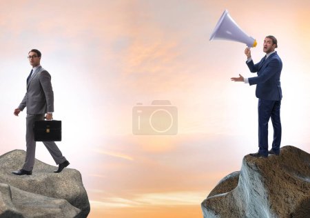 Photo for The businessman shouting with loudspeaker at others - Royalty Free Image