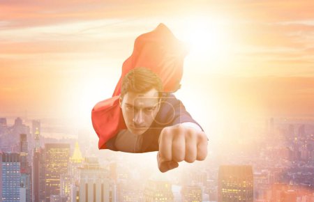 Photo for The superhero businessman flying over the city - Royalty Free Image