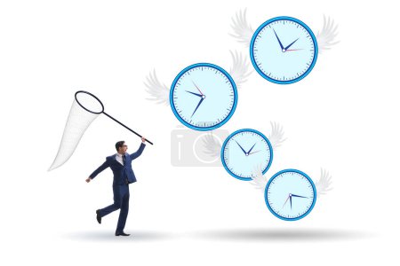 Téléchargez les photos : Concept de date limite avec l'homme d'affaires attrapant horloges - en image libre de droit