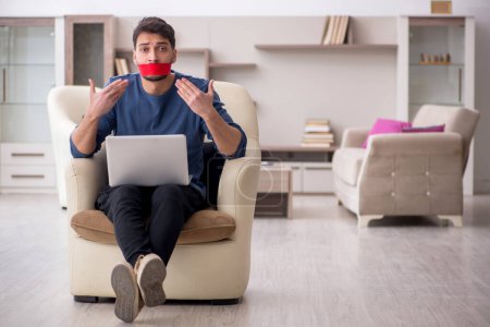 Photo for Mouth closed man working from home - Royalty Free Image