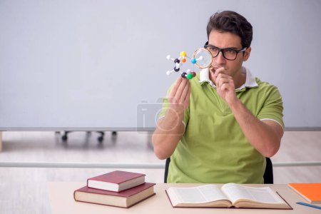 Photo for Young student physicist sitting in the classroom - Royalty Free Image