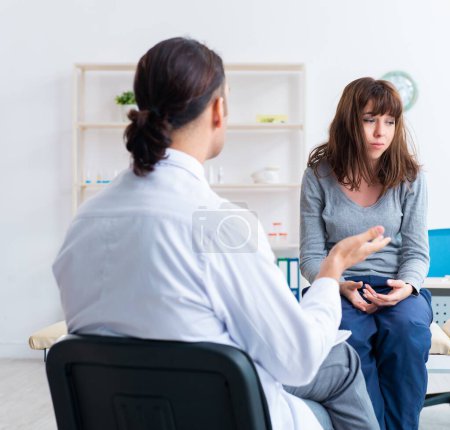 Photo for The mentally ill woman patient during doctor visit - Royalty Free Image