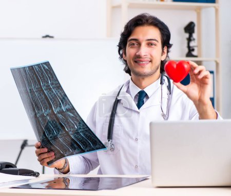 Photo for The young handsome doctor radiologist working in the clinic - Royalty Free Image