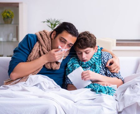 Photo for The young father caring for sick son - Royalty Free Image