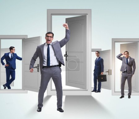Photo for The businessman in uncertainty concept with many doors - Royalty Free Image