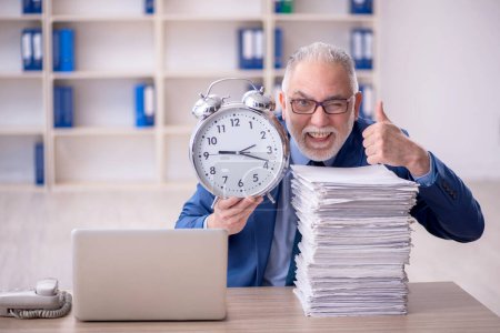 Photo for Old businessman employee in time management concept - Royalty Free Image