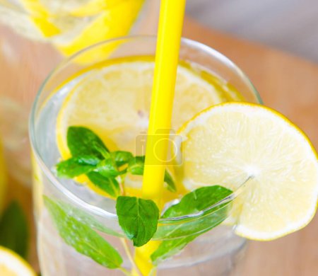 Photo for Glasss of mojito with lemon and drinking straw - Royalty Free Image