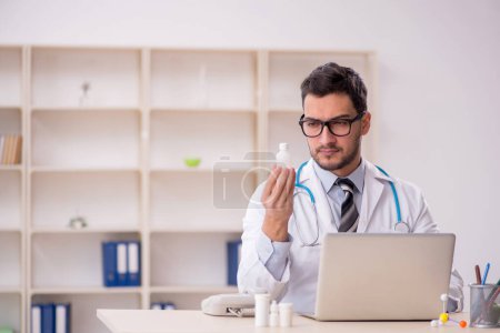 Photo for Young doctor working in the clinic - Royalty Free Image
