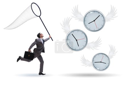 Foto de Concepto de fecha límite con el hombre de negocios la captura de relojes - Imagen libre de derechos