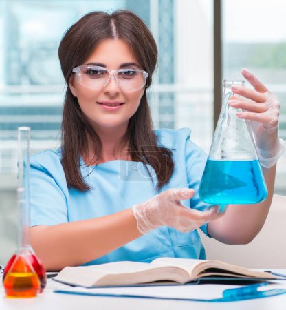 Photo for The young female doctor working in the lab - Royalty Free Image