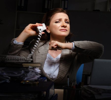 Photo for The female employee suffering from excessive work - Royalty Free Image
