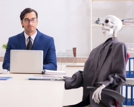 Photo for The funny business meeting with boss and skeletons - Royalty Free Image