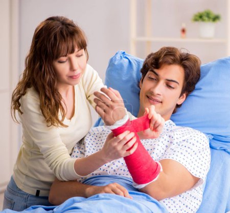 Photo for The loving wife looking after injured husband in hospital - Royalty Free Image