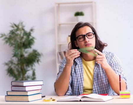 Photo for Male student preparing for exams - Royalty Free Image
