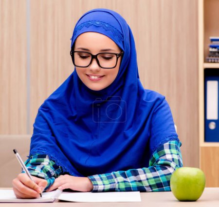 Photo for The muslim girl preparing for entry exams - Royalty Free Image