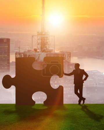 Photo for The business metaphor of teamwork with jigsaw puzzle - Royalty Free Image