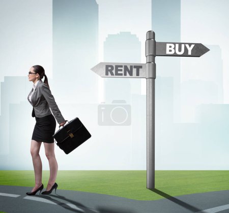 Photo for The businesswoman at crossroads betweem buying and renting - Royalty Free Image