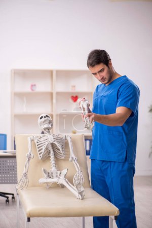 Photo for Young doctor and skeleton patient at the hospital - Royalty Free Image