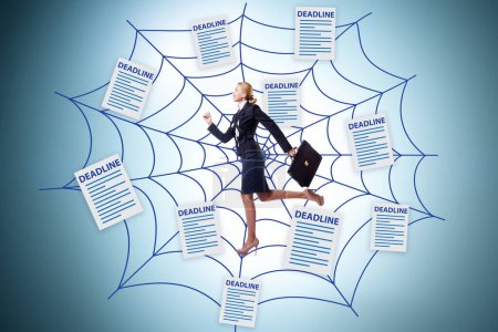 Photo for Businesswoman caught in web of deadlines - Royalty Free Image