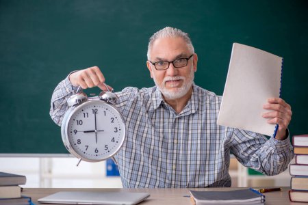 Photo for Old teacher in time management concept - Royalty Free Image