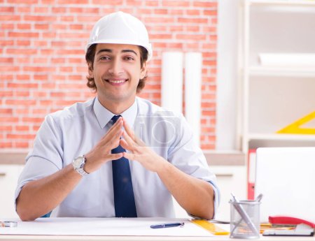 Photo for The construction supervisor working on blueprints - Royalty Free Image